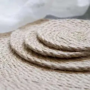Detail view of layered round woven jute placemats showcasing natural braided fiber texture