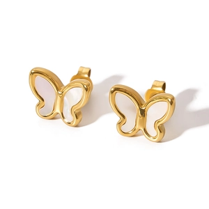 Macro detail of 18K gold butterfly stud earrings with white natural shell inlay