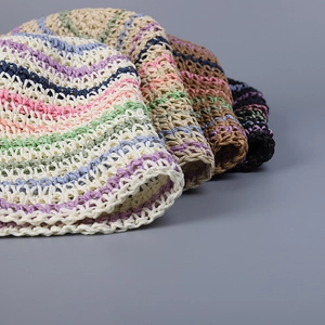 Handmade striped crochet straw bucket hat for women in vibrant summer rainbow colors