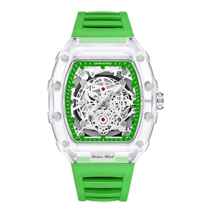 Detail of tonneau-shaped transparent case and green rubber strap on skeleton dial watch
