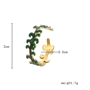 Adjustable titanium steel branch ring with green enamel leaves on a white background