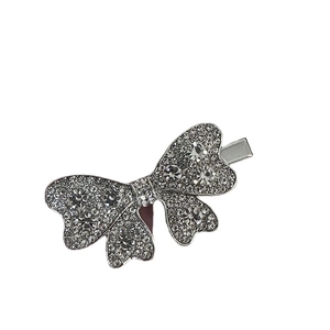 Sparkling silver rhinestone bow hair clip set with premium crystals on white background