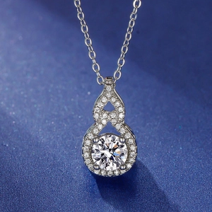 Detailed macro shot of a silver gourd pendant with a 2-carat sparkling cubic zirconia