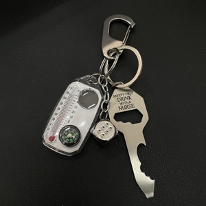 Metal dice keychain set with thermometer, compass and nurse engraved bottle opener