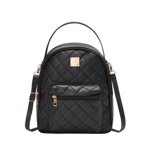 Women's black quilted small backpack with embroidered plain weave and gold metal accents
