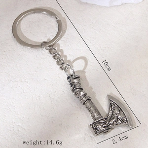 Retro silver metal axe keychain featuring embossed details and product dimensions