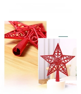 Macro shot of red glitter hollow star topper with intricate iron wire scroll patterns