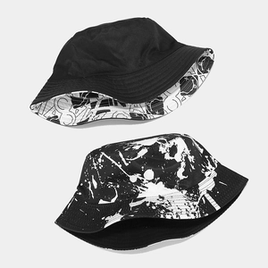 Reversible bucket hat with graffiti print and solid black design for sun protection