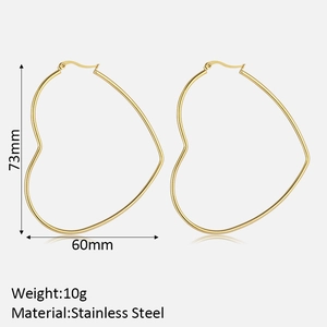 Detailed view of oversized gold heart hoop earrings with dimensions 73mm by 60mm