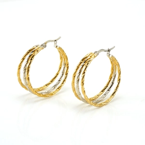 Fashionable multi-layer mixed metal twisted hoop earrings in gold and silver stainless steel