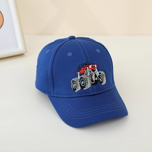 Close-up of the monster truck embroidery on the navy blue cotton baseball cap for kids