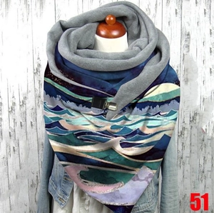 Detail of artistic wave print scarf with thick warm fleece lining and metal buckle closure