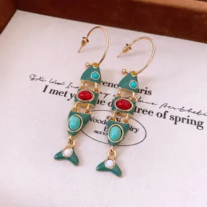Vintage articulated fish tassel earrings with green enamel and colorful gemstones