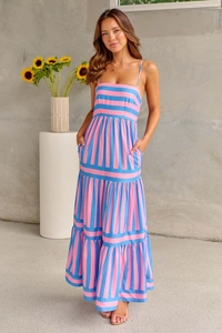 Detail of pink and blue vertical striped maxi dress with tiered ruffle hem and straps