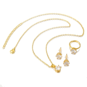 Detailed view of golden jewelry set featuring heart zircon necklace, earrings, and ring