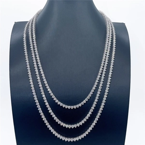 Three-layer silver tennis necklace set with round brilliant-cut zircons on a black display