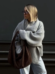 Chic oversized light grey ribbed knit cardigan paired with a brown woven tote bag