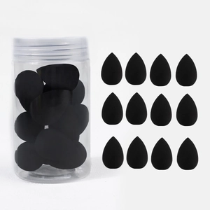 Set of 12 black teardrop makeup sponges in a clear storage jar for wet and dry use