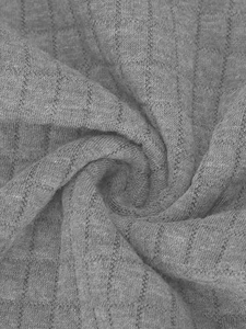 Macro shot of gray waffle knit fabric texture showing detail of men's casual sweatshirt