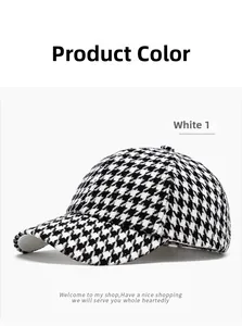 Detail view of the black and white houndstooth fabric pattern on a retro baseball cap