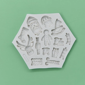 White hexagonal silicone Christmas mold featuring Santa, reindeer, and gingerbread men