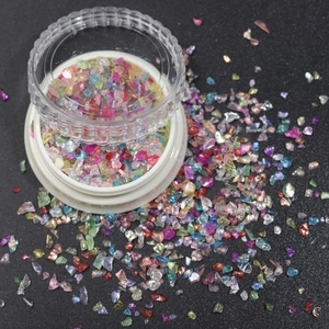 Colorful irregular glass shards in round jar for DIY crafts and nail art decoration