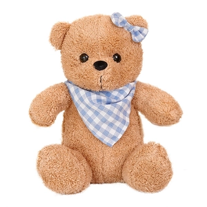 Classic brown teddy bear plush with curly fur and a blue checkered scarf on white background