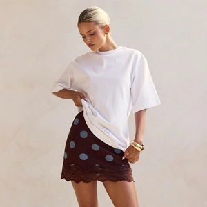 Chic high-waisted brown skirt with blue polka dots and lace trim for women