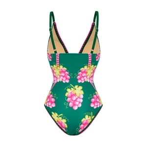 Detail of deep V-neck one-piece swimsuit featuring vintage green and pink grape print