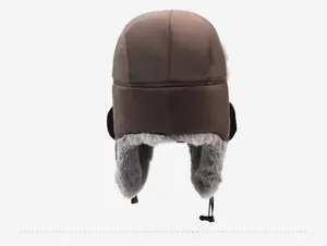 Rear view of brown winter trapper hat with gray faux fur lining and adjustable drawstring