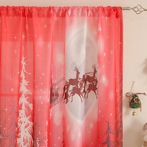 Detail of red Christmas curtain with reindeer and white tree prints on rod pocket drapes