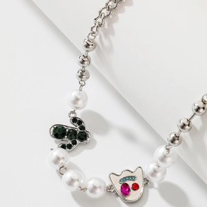 Detail of Halloween devil cactus necklace with pearls and colorful crystal charms