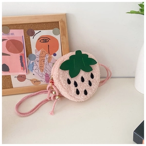 Close-up of cute strawberry plush crossbody bag with green leaf and zipper details