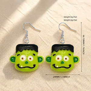 Detail showing dimensions of green Frankenstein Halloween earrings in 29mm width