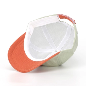 Detail of kids baseball cap interior showing white sweatband and adjustable back strap