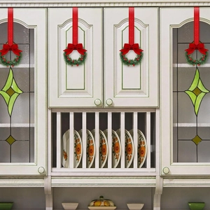 Set of 4 Christmas mini wreaths with red berries and bows on white cabinet doors
