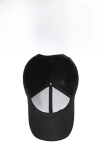 Internal view of black baseball cap showing breathable mesh lining and adjustable metal buckle