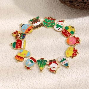 Christmas themed enamel charms set in 18K gold plated stainless steel on white background