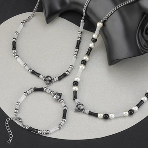 Punk style set with skull charms, black and white beads, pearls and necklaces