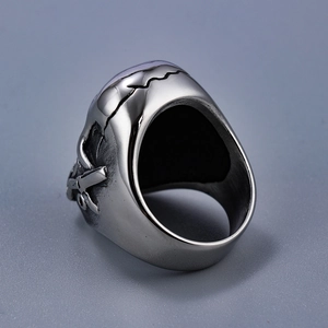 Macro shot of silver finish punk skull ring showing thick inner band and vintage texture