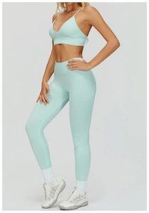 Detail view of mint green seamless yoga set with double straps and high waist leggings