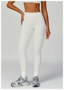 Detail of high-waisted ribbed yoga leggings showing vertical knit texture and slim fit