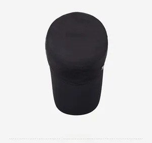 Top down view of a black quick-dry flat top military cap with metal logo detail
