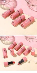 Macro display of velvet matte heart lipsticks with elegant pearls and pink glass props