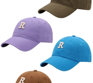 Detail of soft-top baseball caps with towel-embroidered R logo in multiple colors