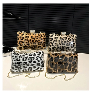 Macro shot of leopard print evening bags in four colors with crystal-inlaid locks