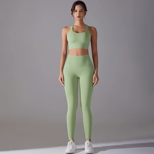 Women's light green seamless yoga set with sports bra and high-waisted leggings