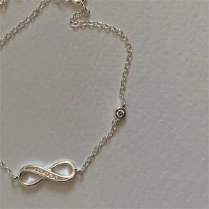 Minimalist S925 sterling silver infinity bracelet with sparkling cubic zirconia inlay