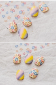 Detailed 3D embossed nail art stickers with vibrant floral patterns and gradient colors