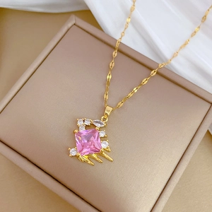 Elegant gold titanium steel necklace with a square pink zircon pendant on a display box
